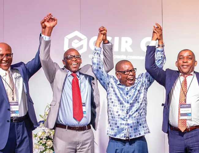 CSIR employees standing in front of a screen
